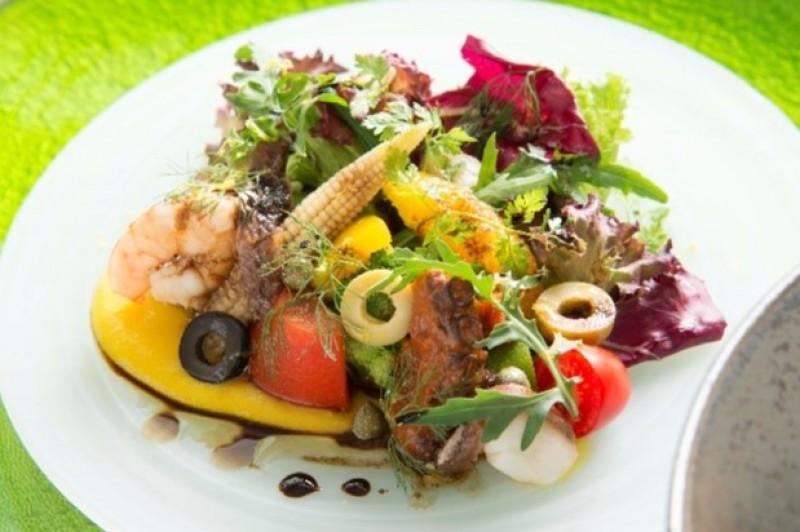 Seafood salad with 20 varieties of ingredients with organic Sicilian lemon dressing and orange coulis